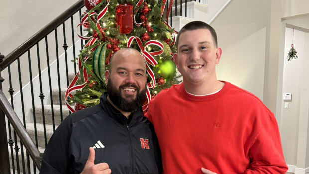 Gibson Pyle with Nebraska offensive line coach Donovan Raiola.